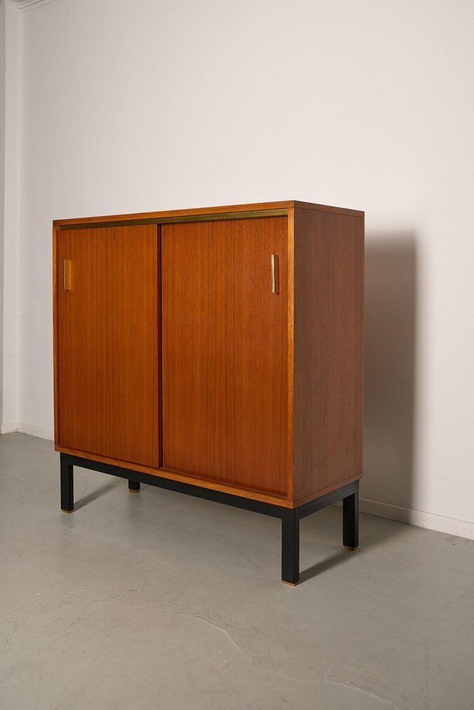 Teak Cabinet With Brass Details And Black Metal Base, 1970s photo for sale