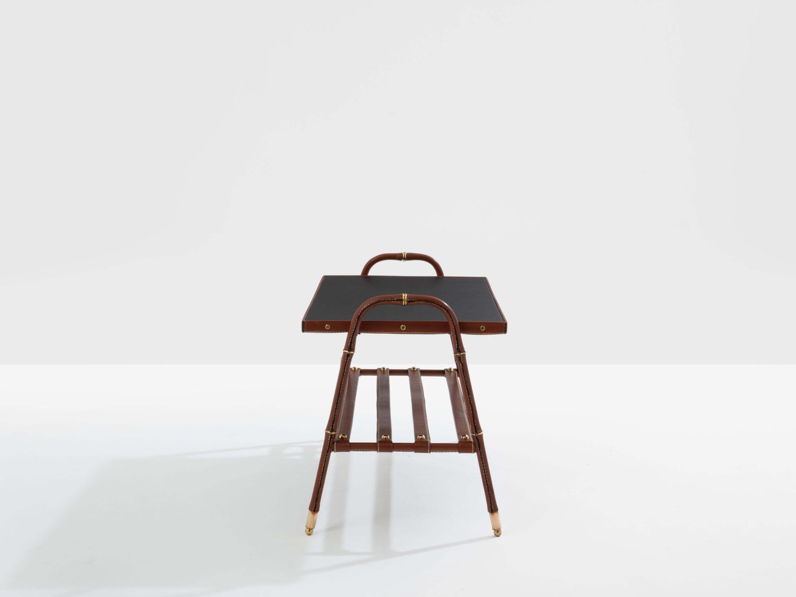 Table basse Jacques Adnet piqué sellier en cuir rouge et laiton, 1950 photo for sale