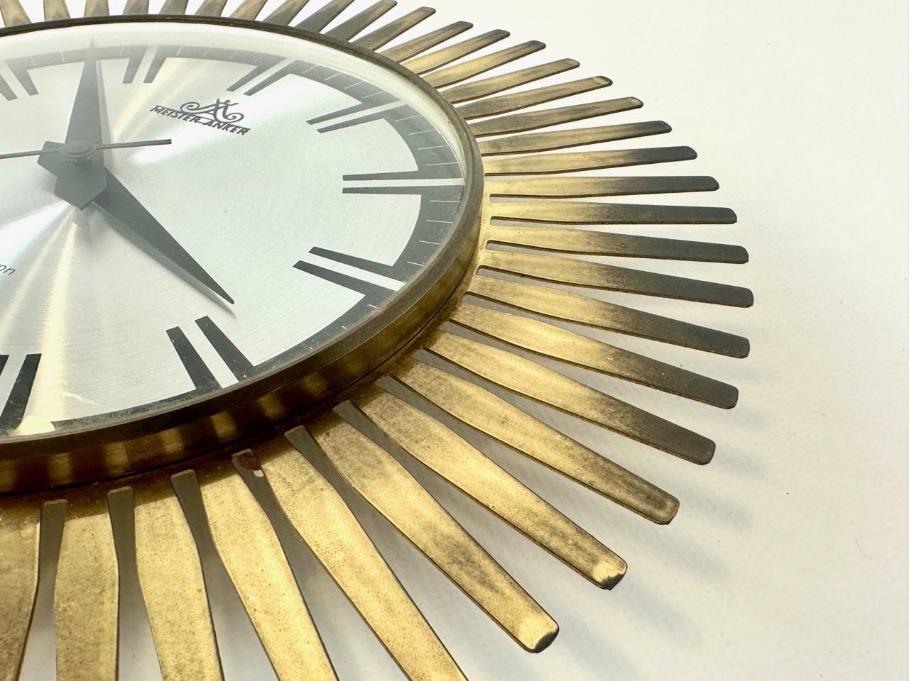 Mid Century Modern Sunburst Wall Clock In Brass From Meister Anker, 1960s photo for sale