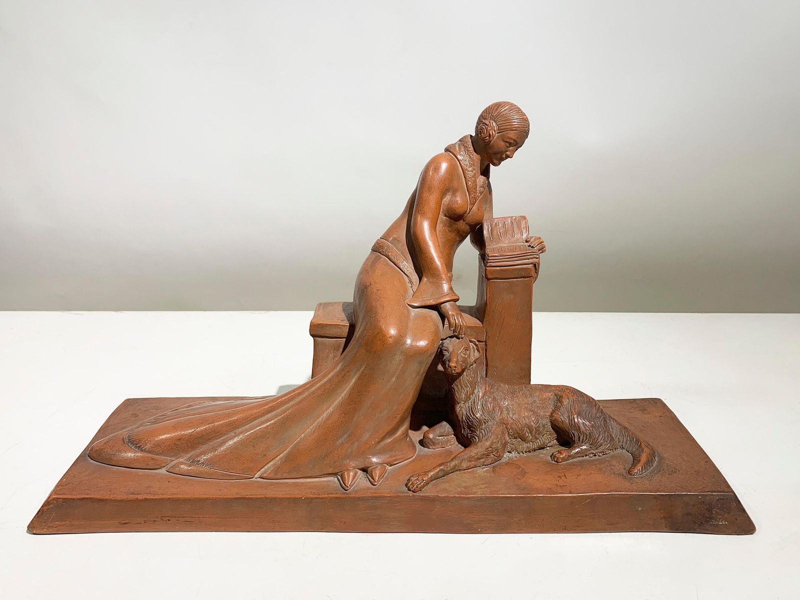 Art Deco Terracotta Sculpture Of A Seated Woman With Dog Signed"Eribe"Circa 1930 photo for sale