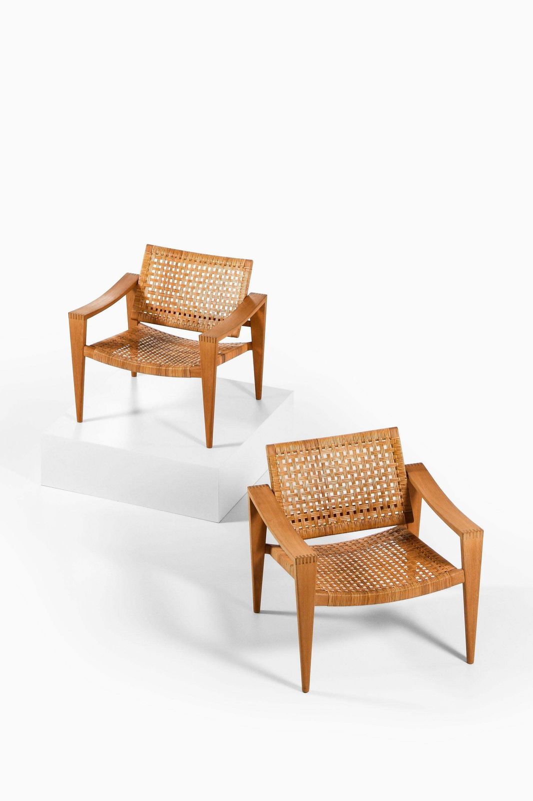Pair Of Easy Chairs In Oak, Woven Cane, Brass And Leather By Hans Wegner, 1959 photo furniture