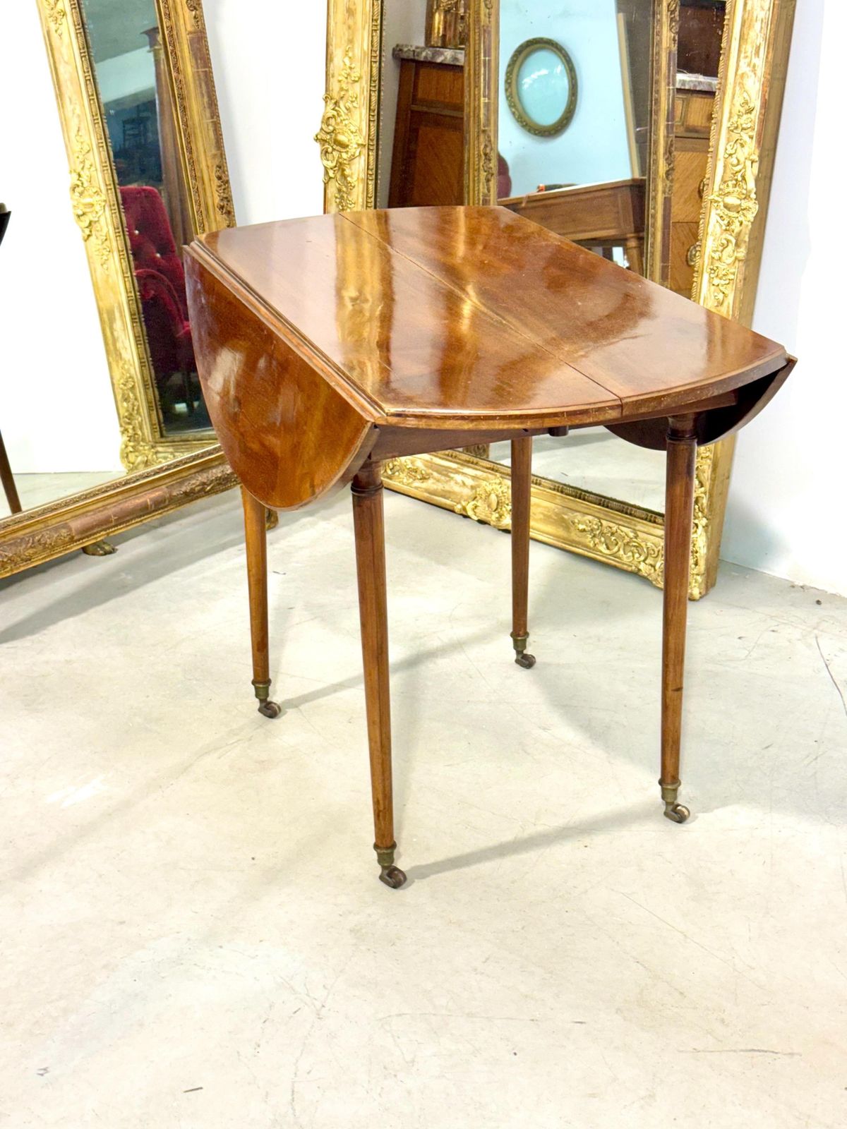 Early 19th Century French Cherrywood Drop Leaf Table On Gilt Bronze Casters photo Furniture