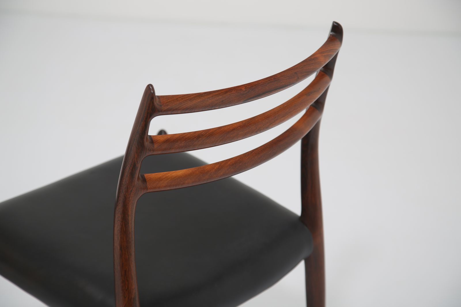 Furniture Niels Otto Møller Model 78 Dining Chairs: Set Of 8 In Solid Rosewood And Black Leather For J.L. Møllers, 1960s. photo