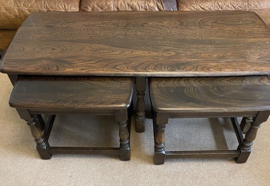 Ercol Trinity Nest Of 3 Coffee Tables, Made From Elm And Consists Of Main Coffee Table And 2 Side Tables. photo furniture