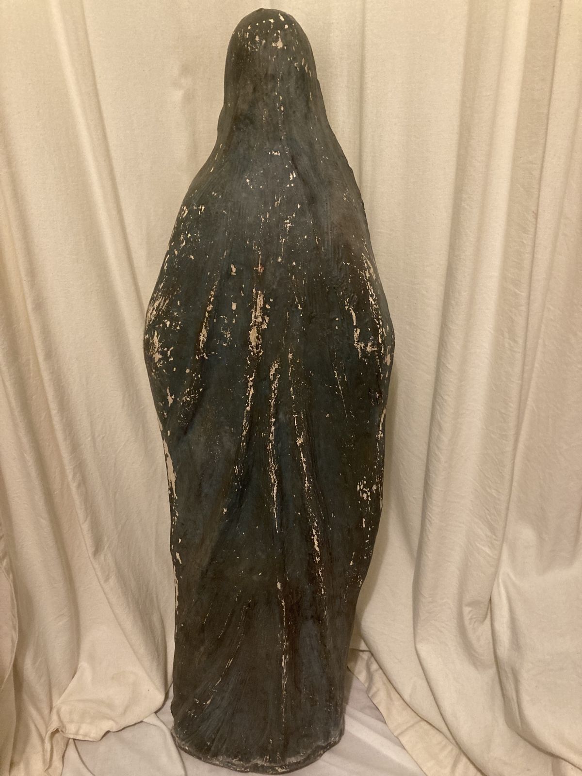 Antique Statue Of The Young Virgin Mary Holding A Lily. photo vinterior