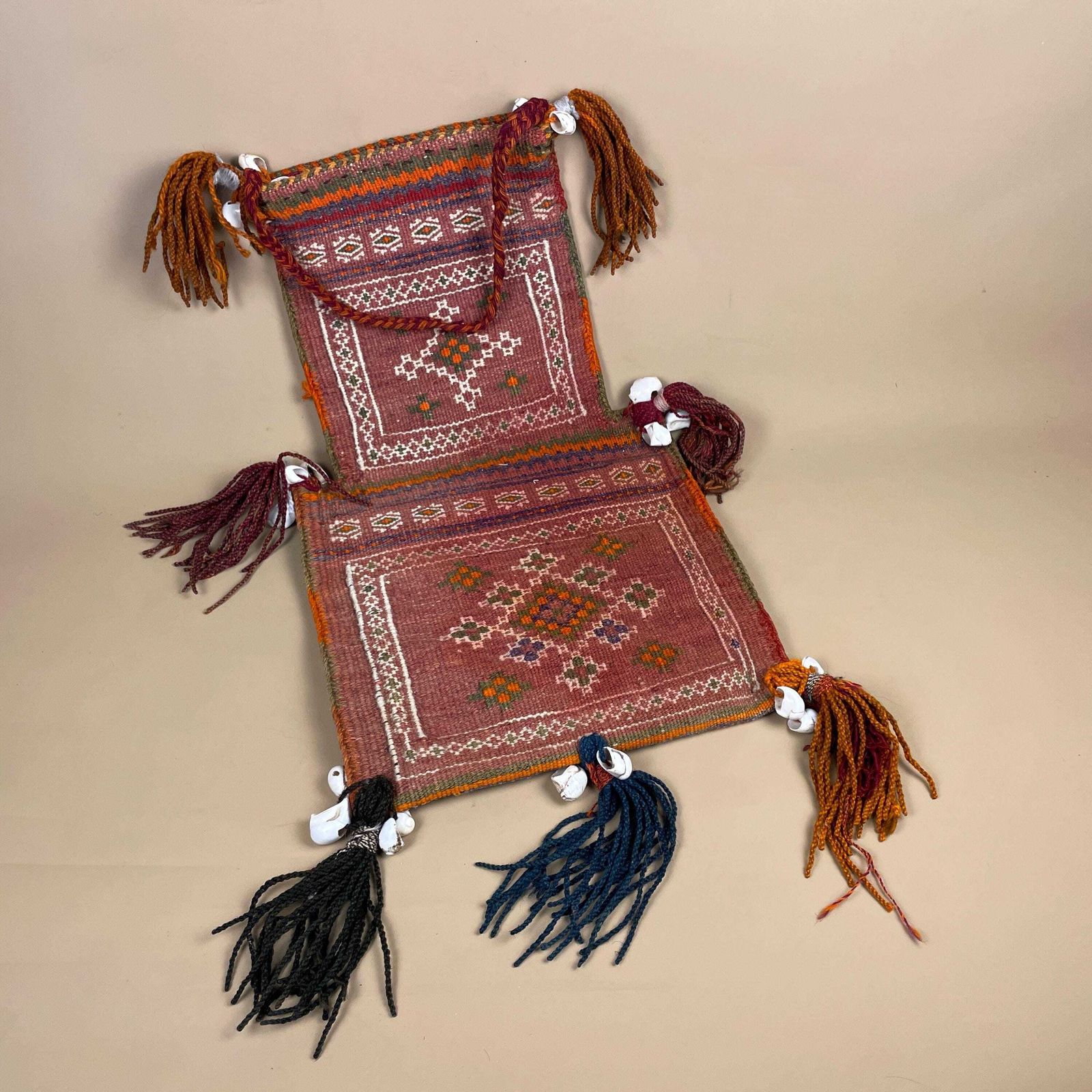 Vintage Saddle Bag Wall Hanging Handwoven Wool Tribal Textile Pouch Tassels Red Middle Eastern Design Folk Textile Woven photo furniture