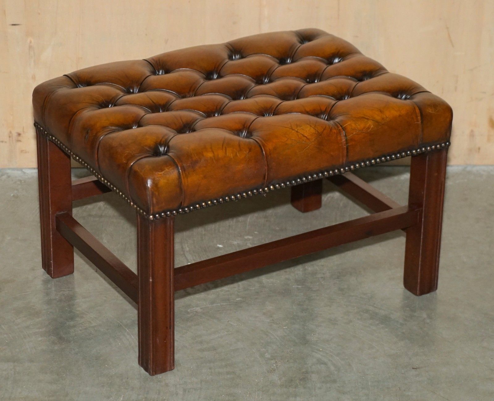photo vintage Pair Of Restored Vintage Hand Dyed Brown Leather Chesterfield Tufted Footstools