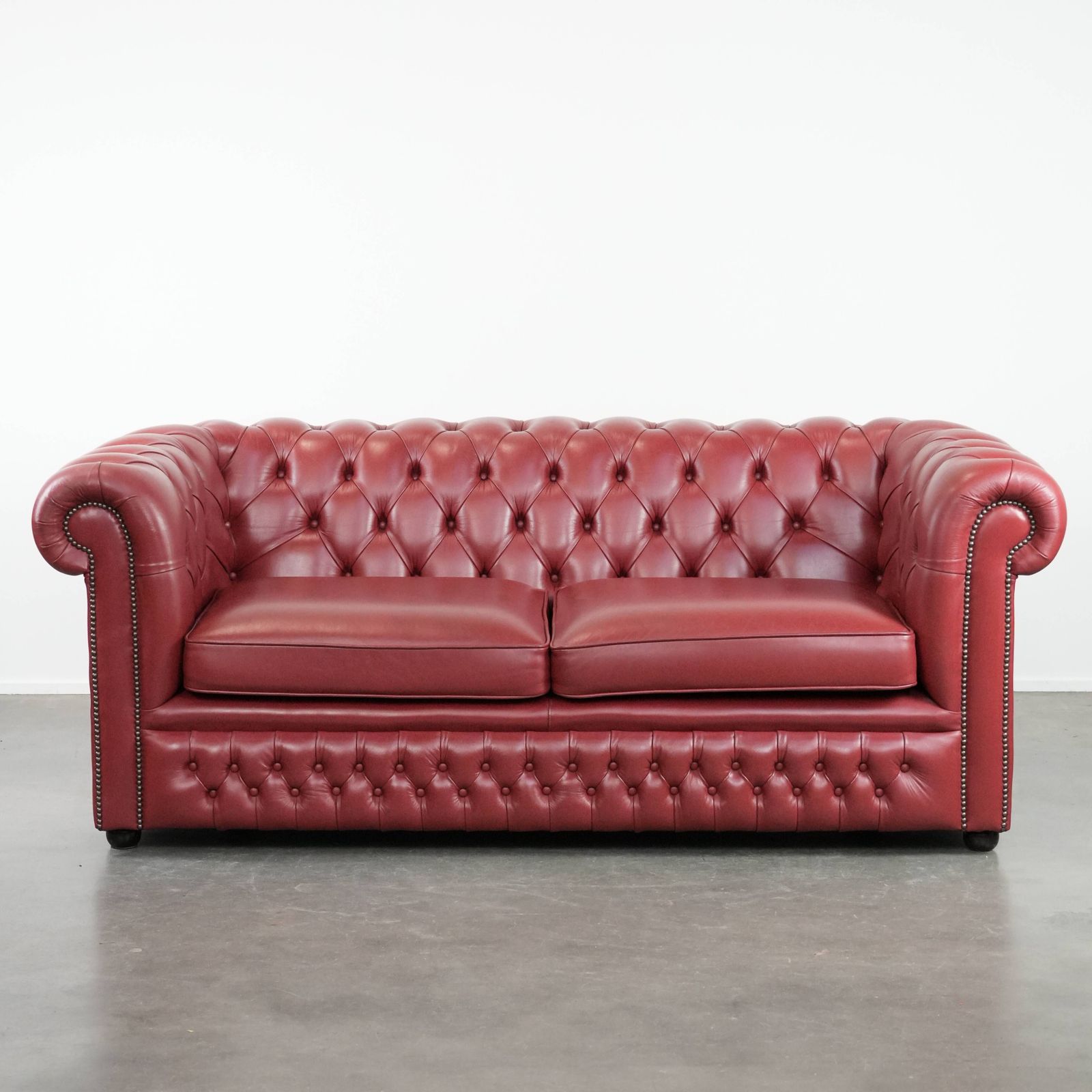 Beautiful English 2.5 Seater Cowhide Chesterfield Sofa In A Stunning Red Color.