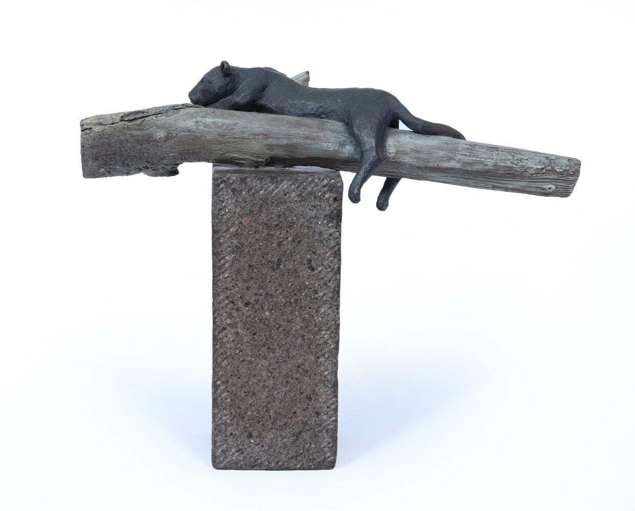 Bronze Sculpture Of A Resting Lioness On Cold Painted Log photo vinterior