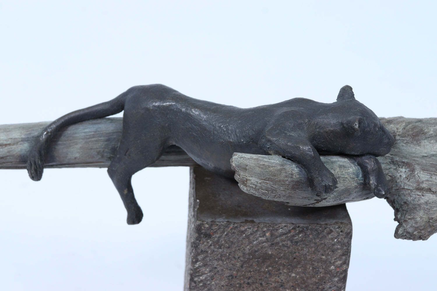 680.0 Bronze Sculpture Of A Resting Lioness On Cold Painted Log photo