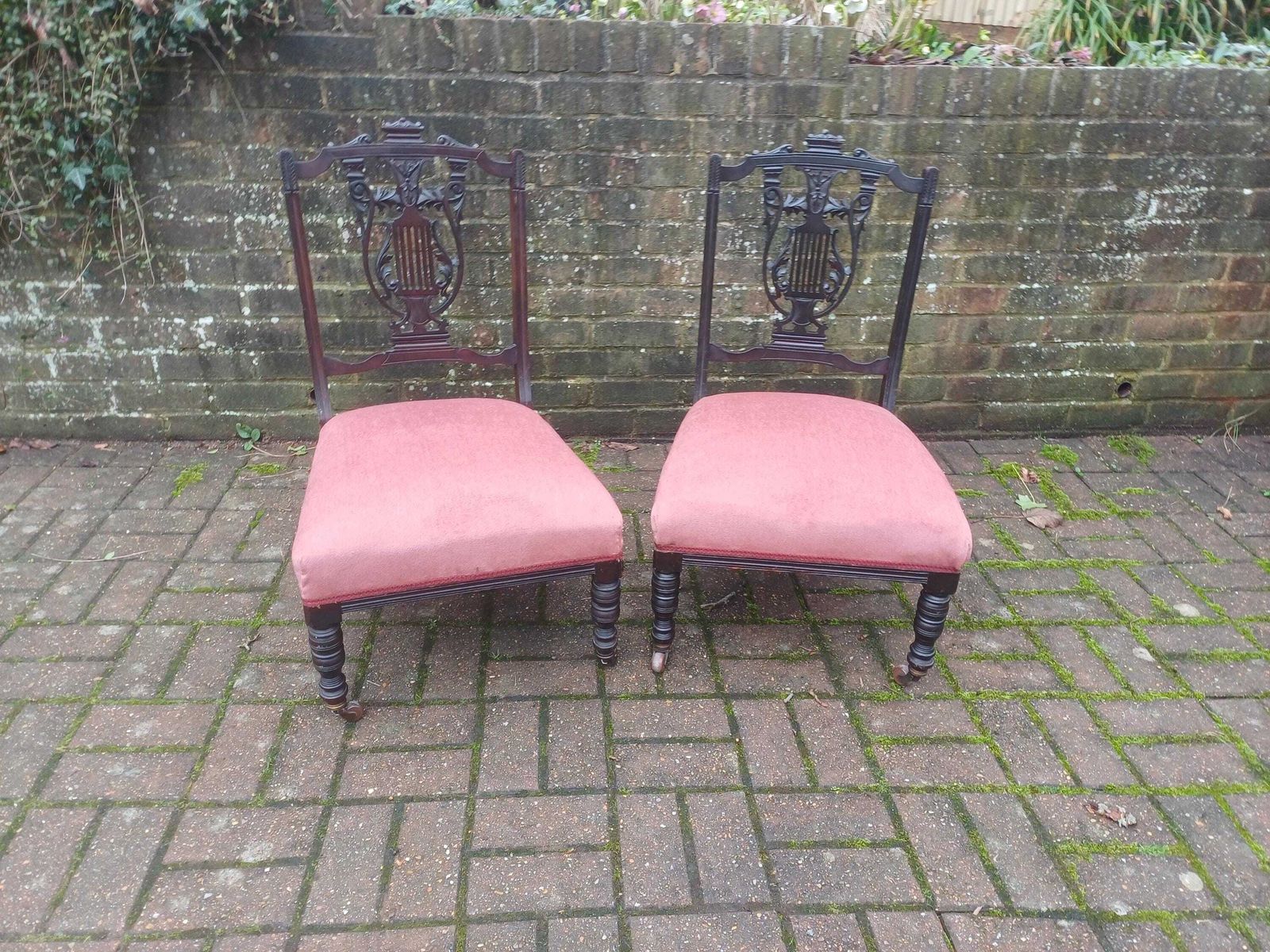 Pair Victorian Mahogany Occasional Chairs Ebonised Finish Carved Fretwork Backs Turned Legs Porcelain Castors Pink Seats