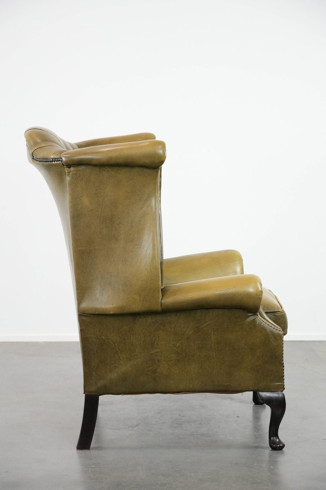 Moss Green Cowhide Chesterfield Wingback Armchair In English Style Finished With Decorative Nails photo for sale