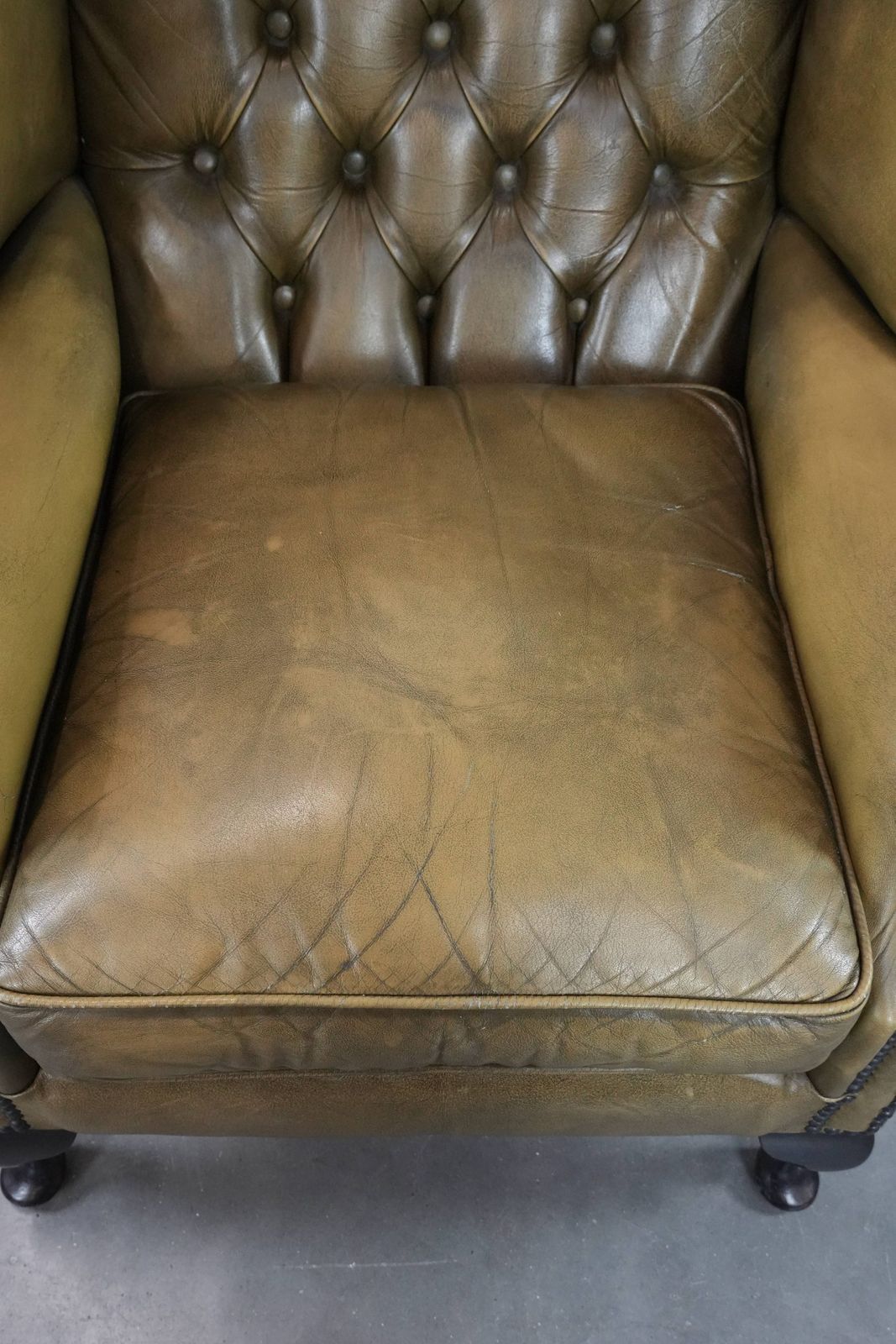 Moss Green Cowhide Chesterfield Wingback Armchair In English Style Finished With Decorative Nails photo vinterior