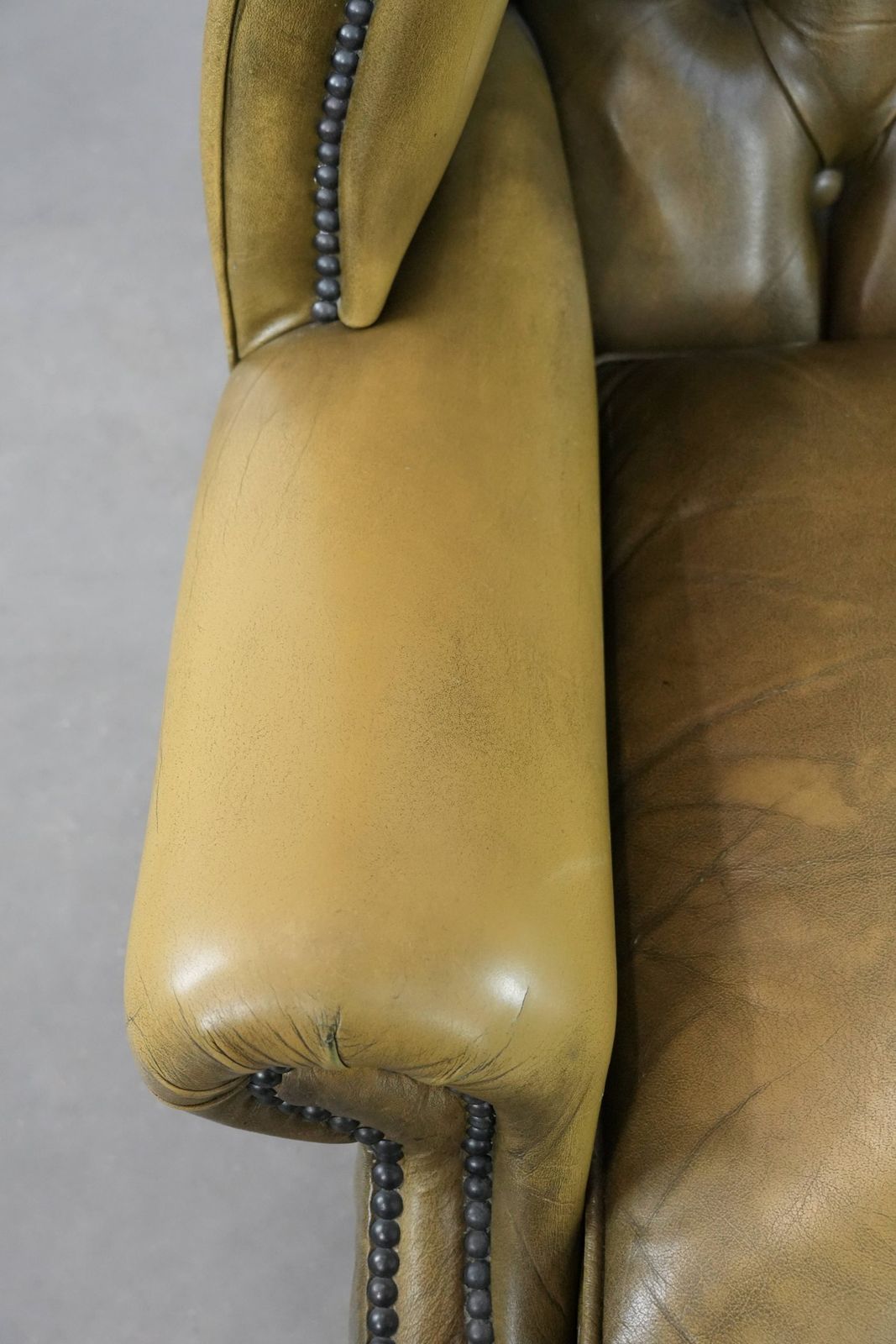Moss Green Cowhide Chesterfield Wingback Armchair In English Style Finished With Decorative Nails photo buy