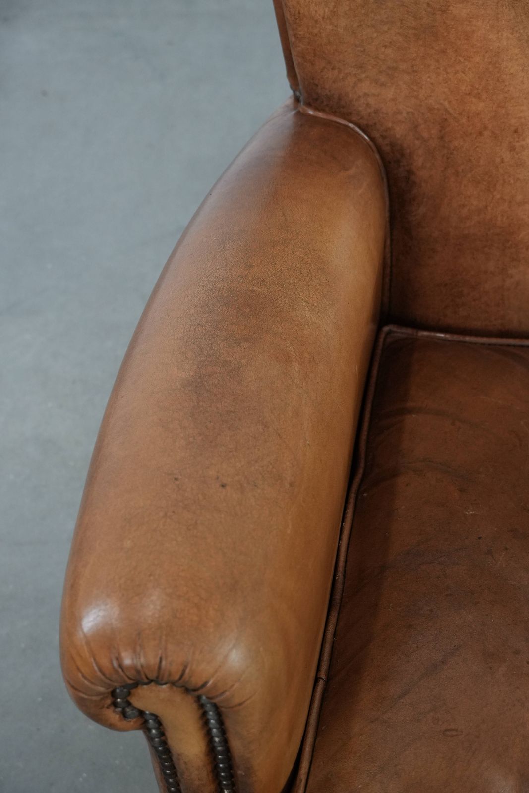 Vintage Fauteuil Van Schapenleer Met Karakter En Warme Kleuren photo buy