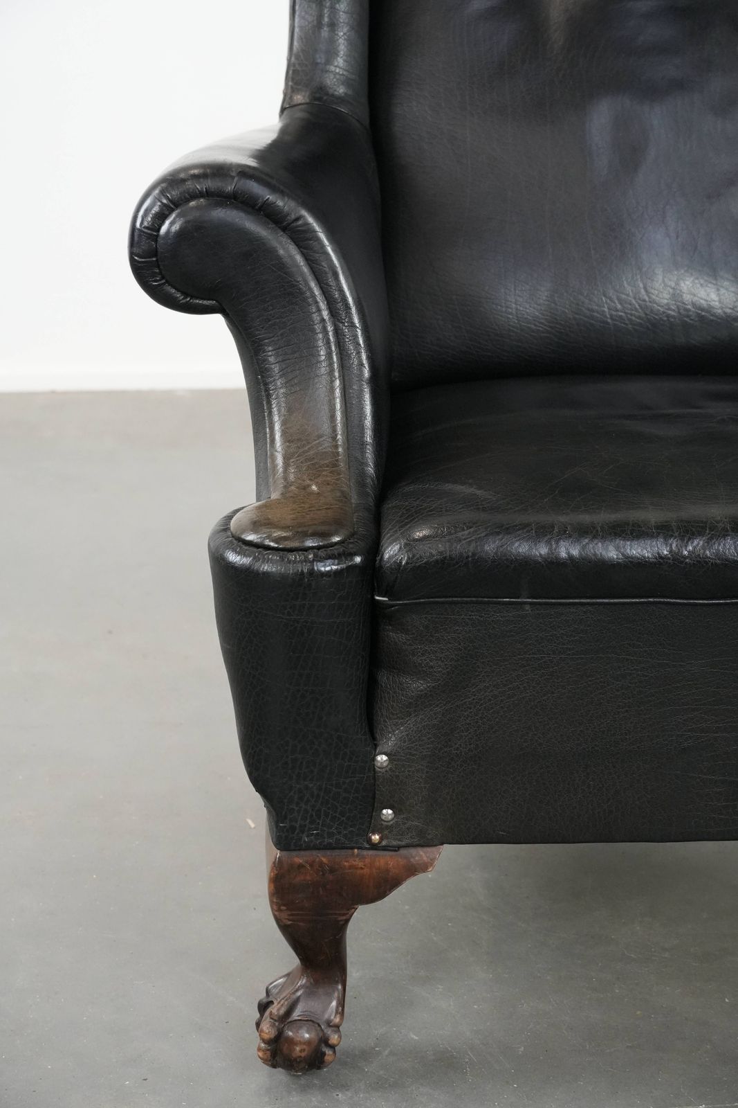 Large Antique Black English Cowhide Wing Chair From The Late 19th Century With A Luxurious Appearance photo buy