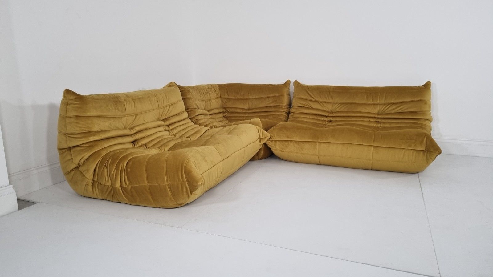 photo furniture Ligne Roset Togo 2 X 2 Seater And Corner In Bronze Gold Velvet