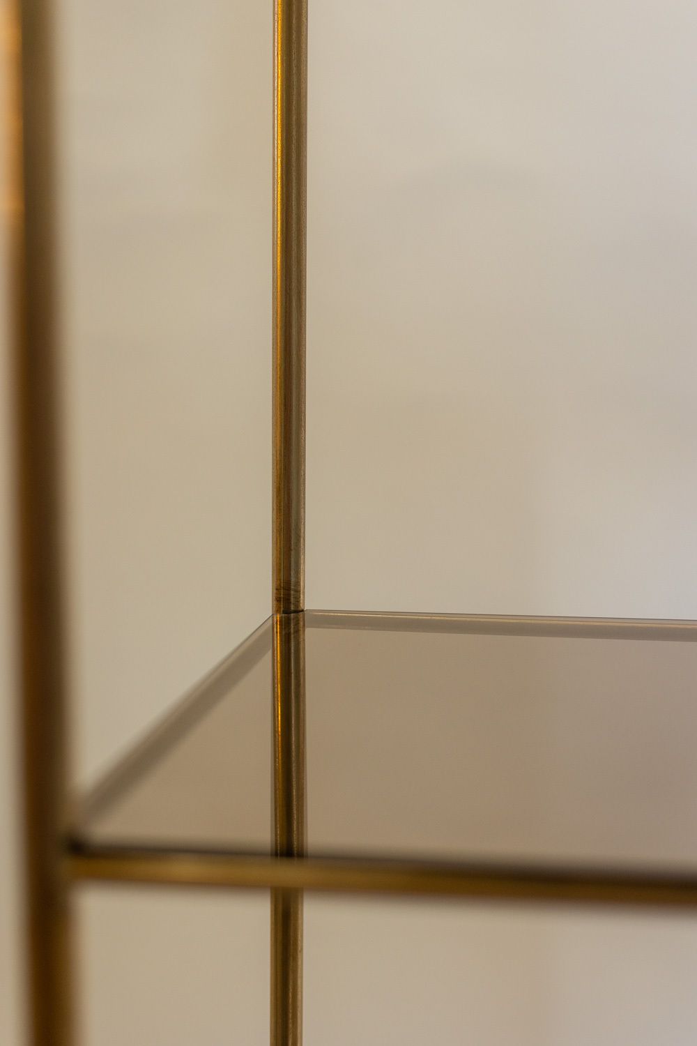 photo furniture Shelf In Gold Plated Brass With Smoked Glass Shelves. 1970s.