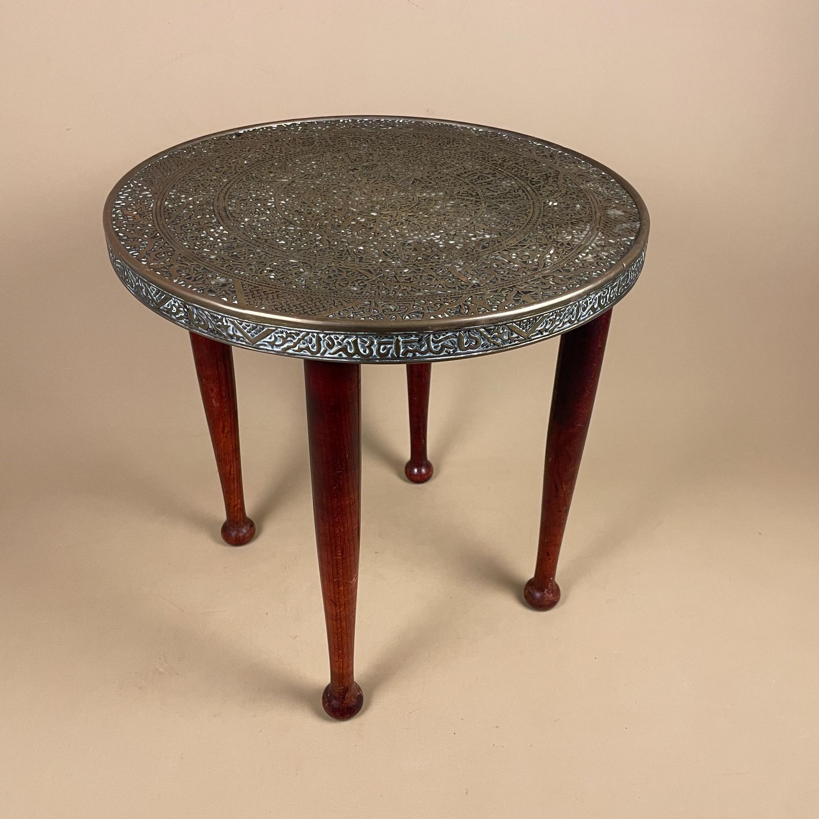 photo furniture Antique Metal Gold Brass Indian Table Patterned Tray Top Asian Handmade Intricate Decorative Round Coffee Side Wood Pin Legs Vintage