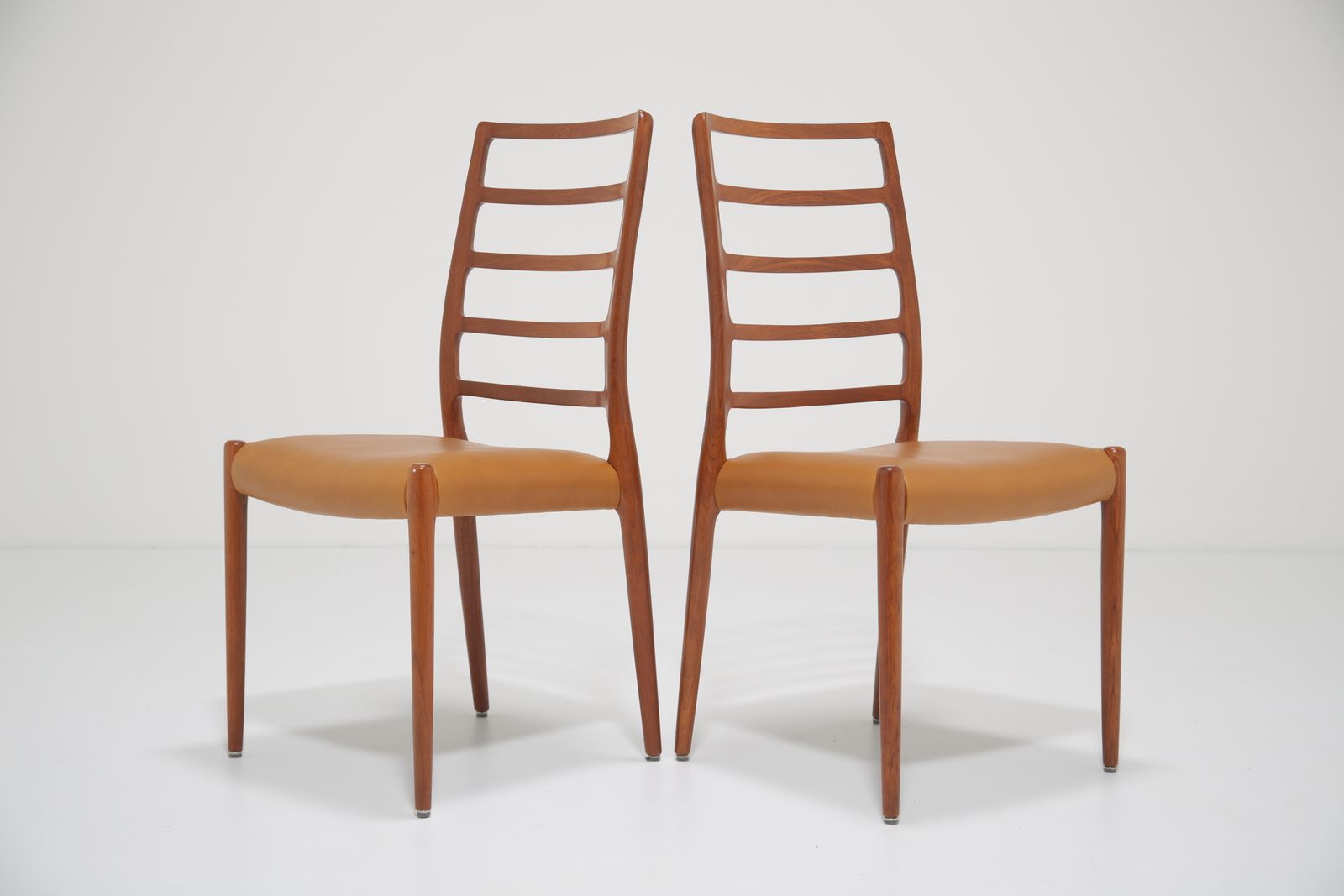 photo furniture Niels Otto Møller Model 82 Dining Chairs: Set Of 8 In Solid Teak And Tan Leather For J.L. Møllers, 1960s