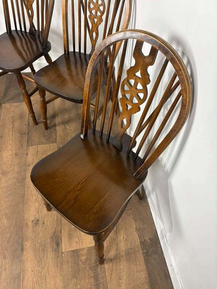 319.0 Vintage Set Of Four Dark Oak Wheel Back Chairs photo