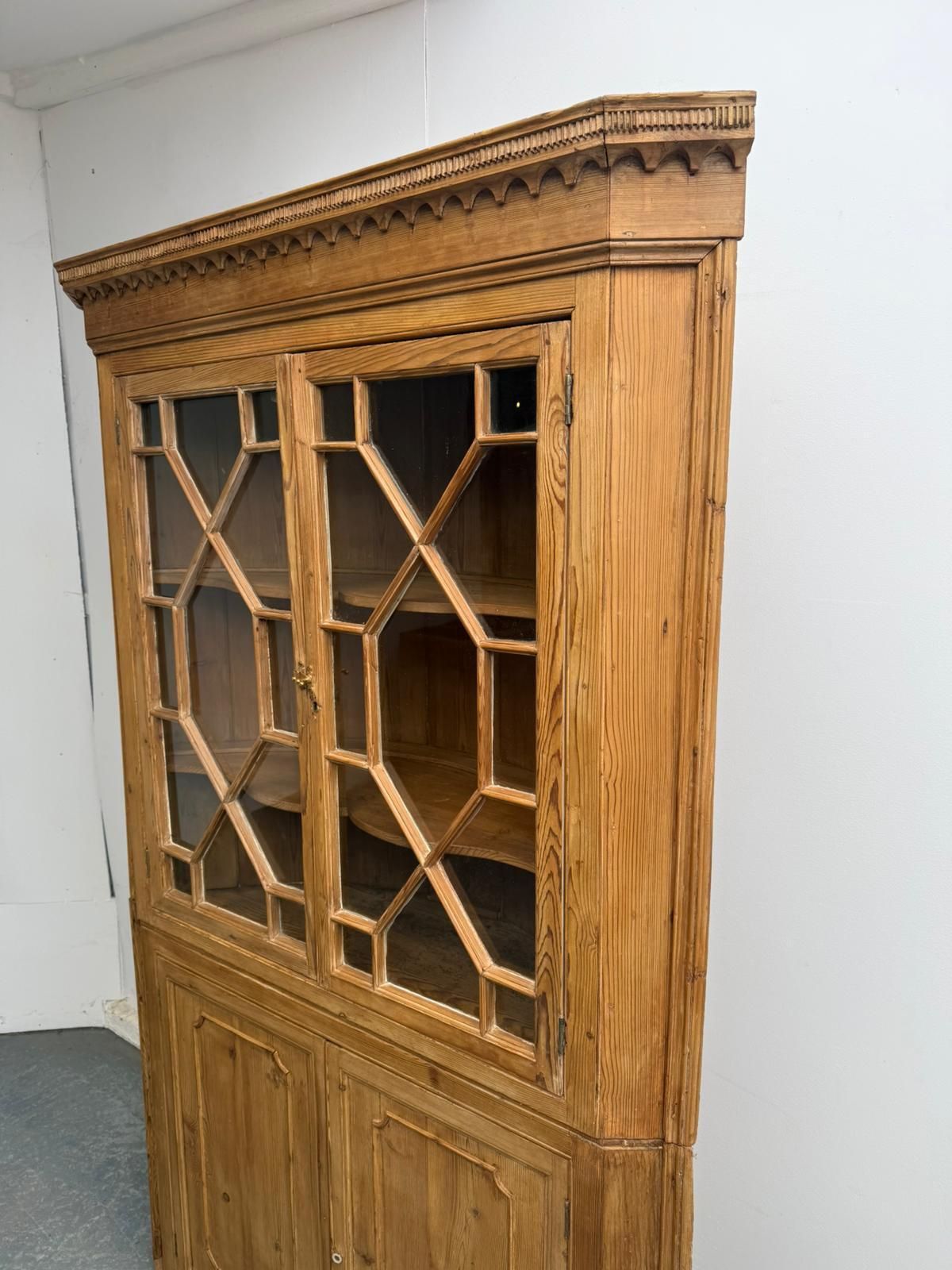 A Rare Early Georgian Pine Astral Glazed Barrel Back 2 Piece Cabinet photo for sale