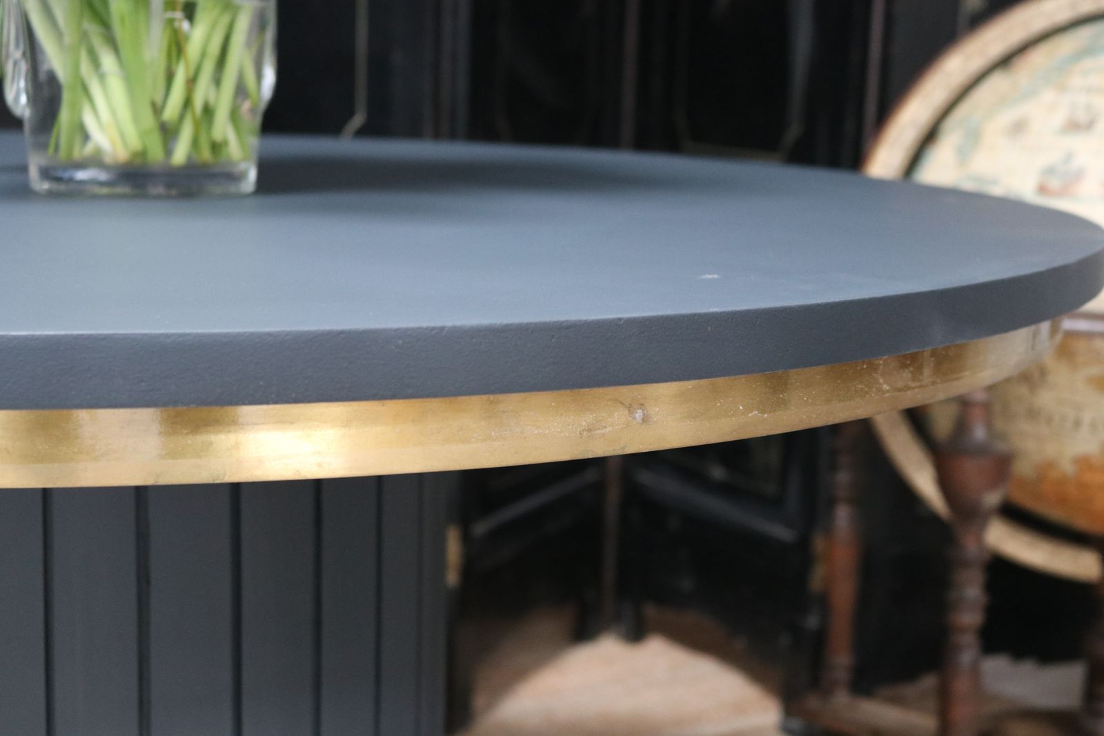 photo for sale Stunning Black Round Dining Table With Brass Metal Edge Slatted Wood Column Base