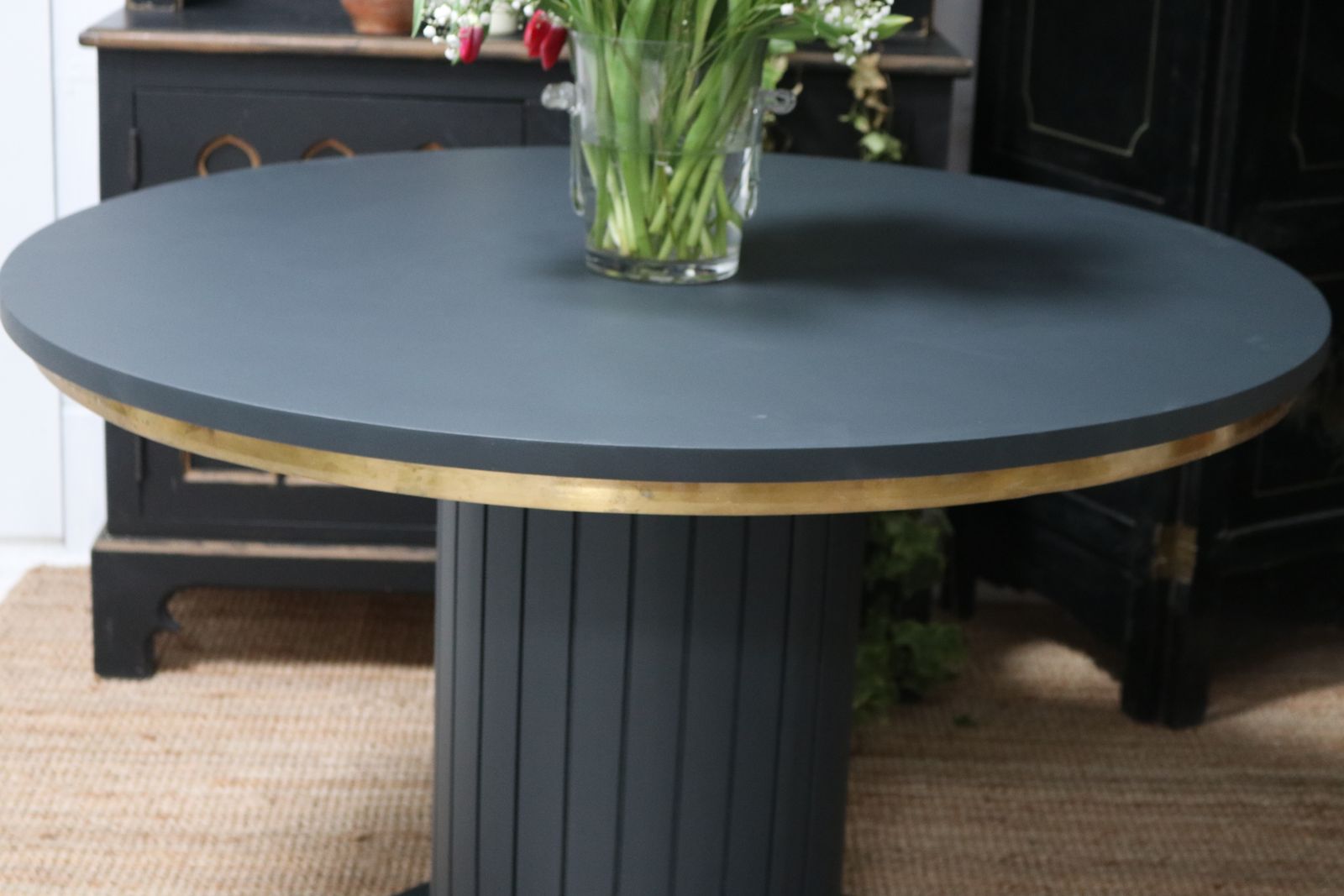 photo buy Stunning Black Round Dining Table With Brass Metal Edge Slatted Wood Column Base