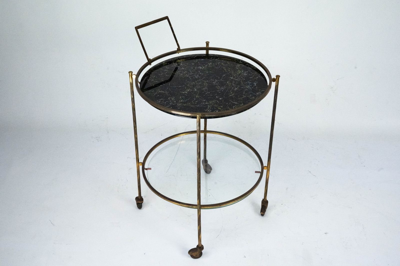 photo furniture Round Mid Century Brass And Marble Effect Glass Bar Cart. Italy 1950s
