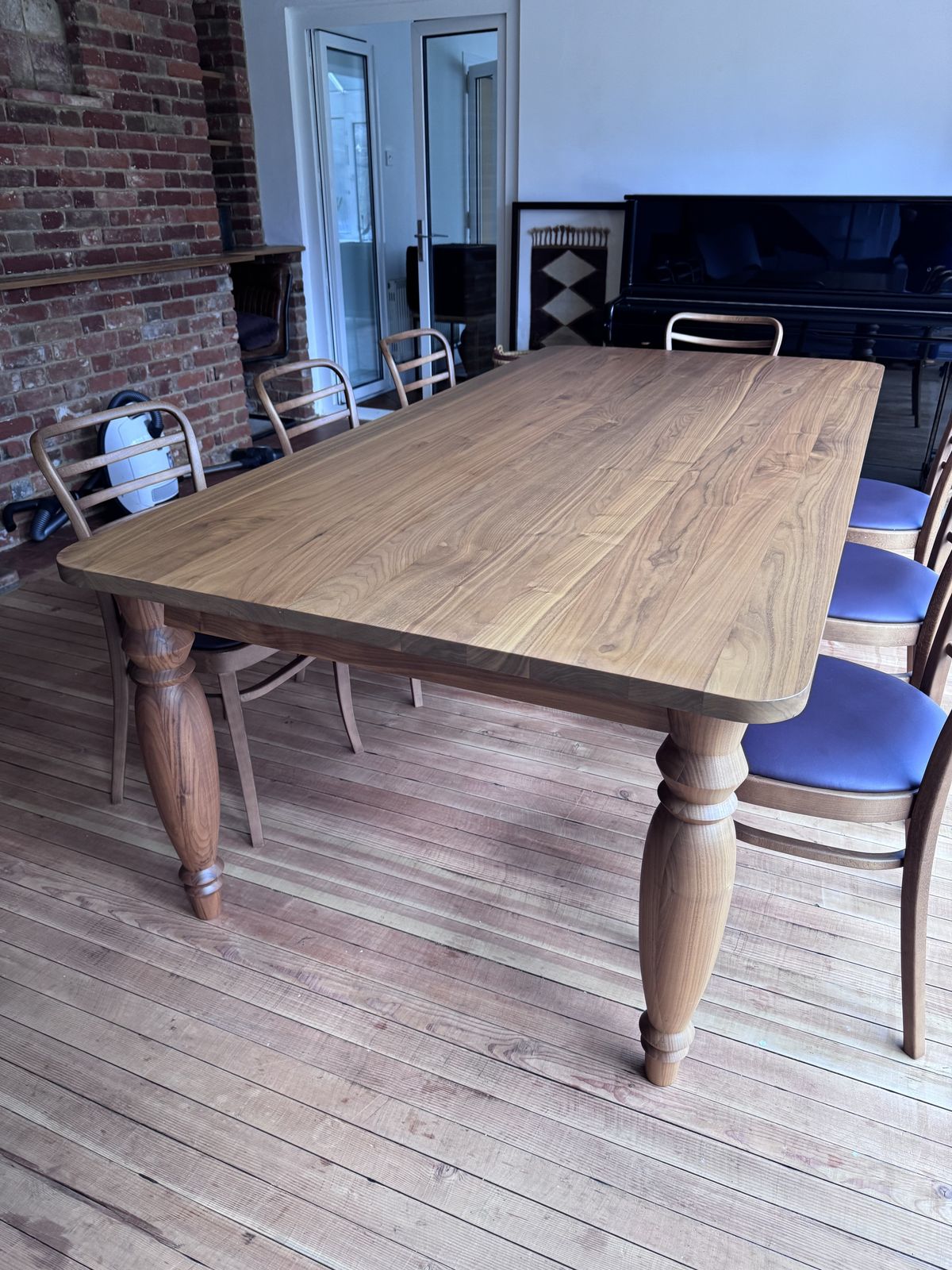 Benchmark Mrs B Dining Table In Walnut Designed By Russel Pinch With 8 Leather Upholstered Vienna Dining Chairs photo buy