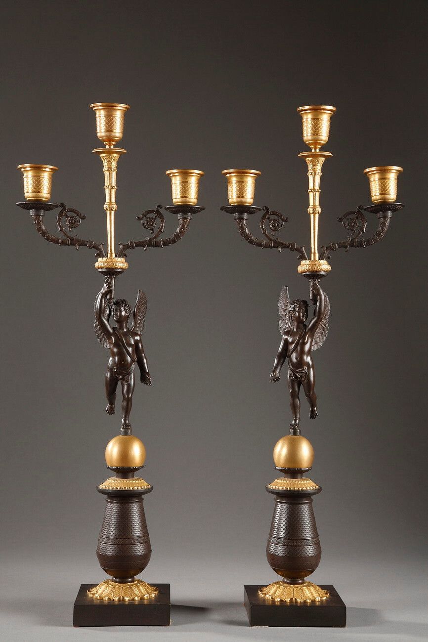Pair Of Putti Candelabra In Gilt And Patinated Bronze