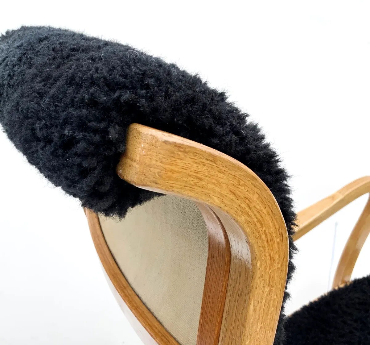 photo buy Vintage G.A. Berg “Torparen” Armchair, Oak, Black Sheepskin, With Ottoman 1960s