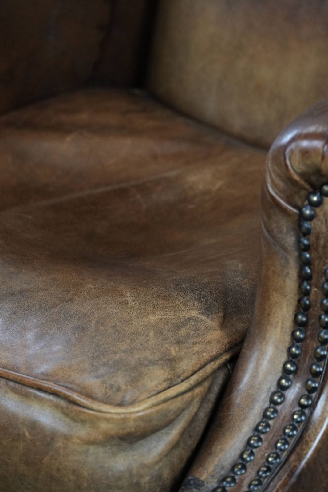 photo vinterior Warm, Cozy And Comfortable Vintage Sheepskin Armchair With Character