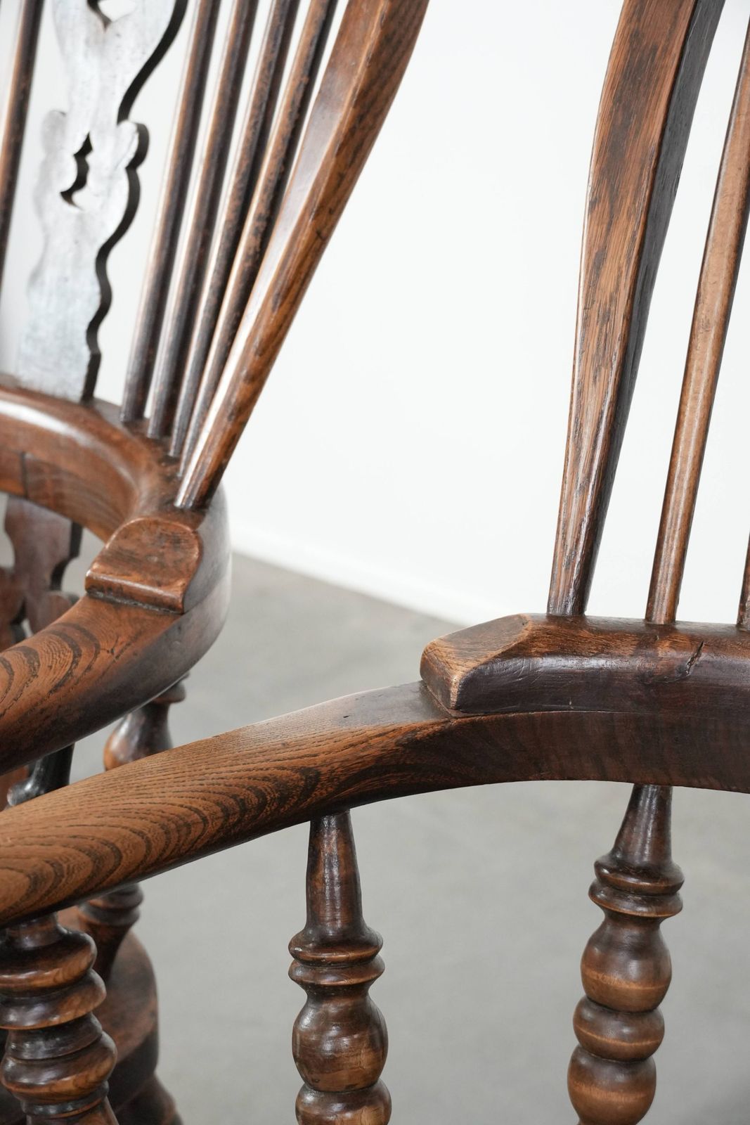 photo for sale Set Of Two Antique English Highback Windsor Chairs From The 18th Century With A Beautiful Color Scheme