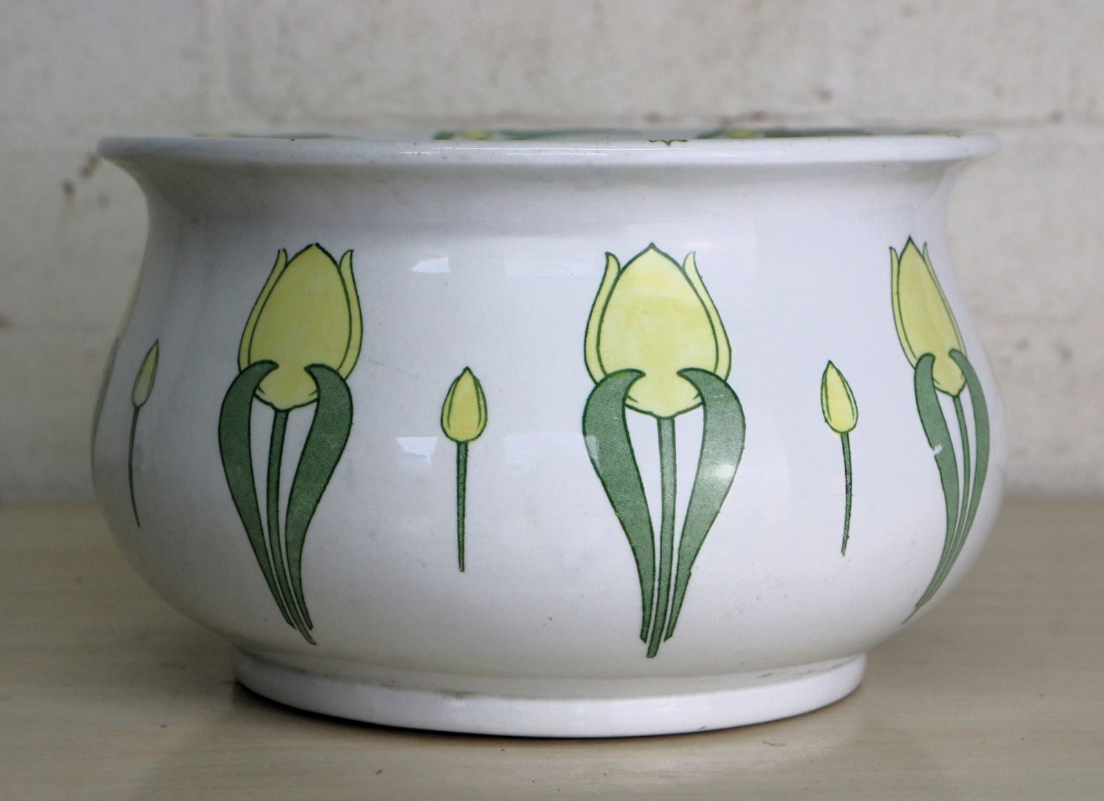 An Art Nouveau Decorative Ceramic Chamber Pot With Stylised Yellow Tulips photo furniture