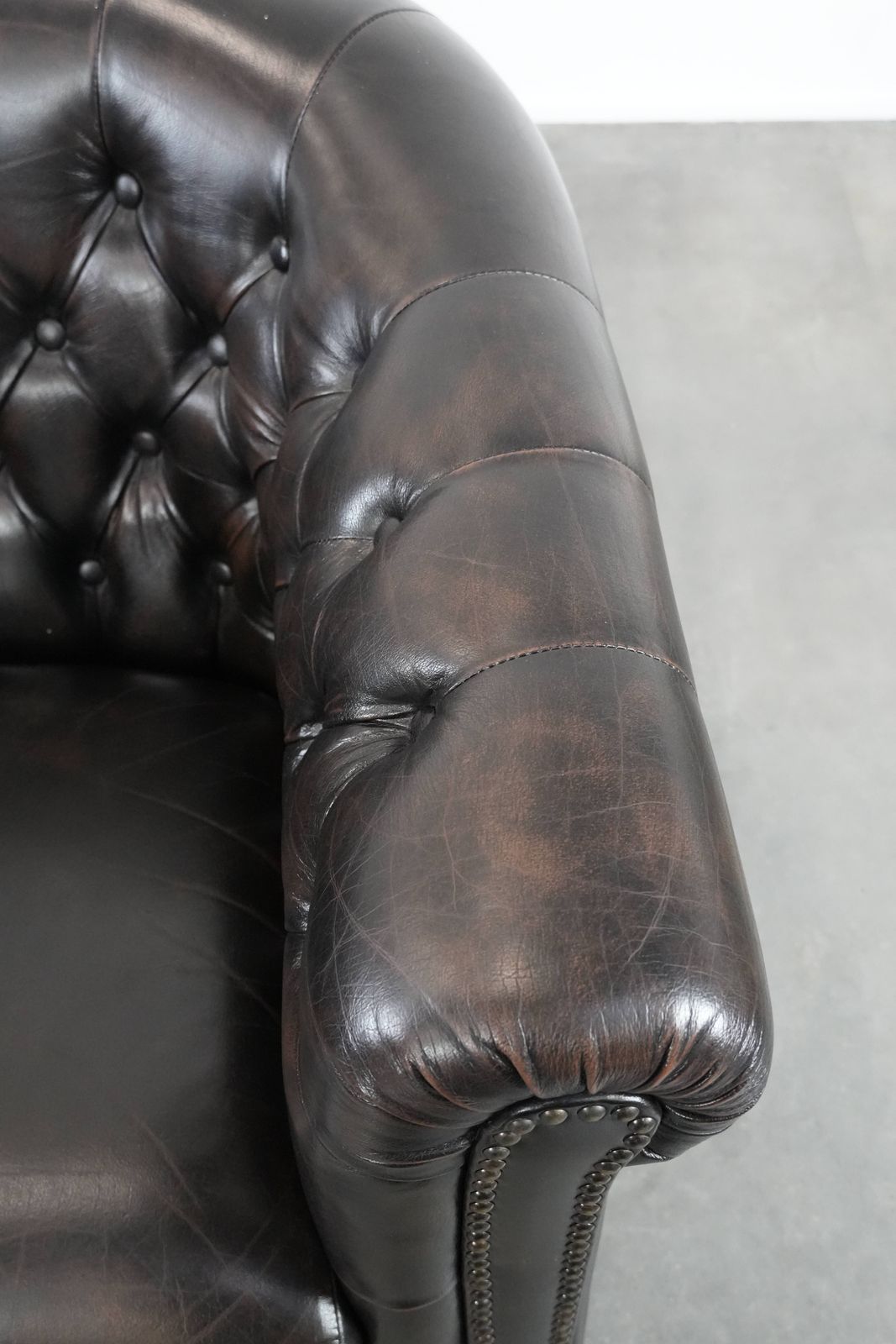 Dark Luxurious Cowhide Chesterfield Club Armchair In English Style, Finished With Decorative Nails photo vintage