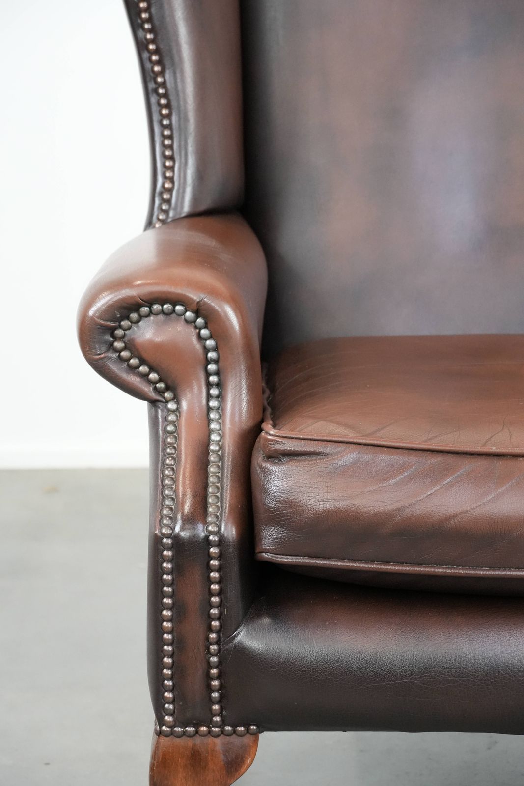 Furniture Nice Brown Smooth Cowhide Chesterfield Armchair In English Style Finished With Decorative Nails photo