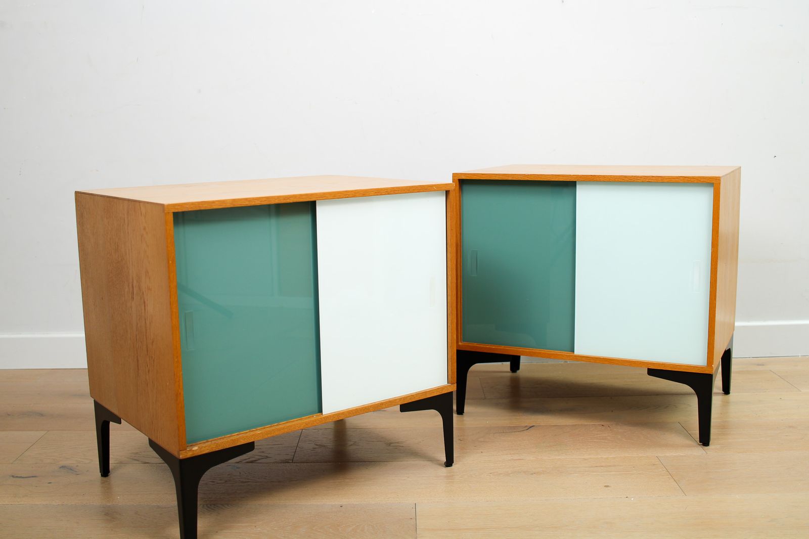 A Pair Of Vintage Mid Century Bedside Tables With Glass Sliding Doors