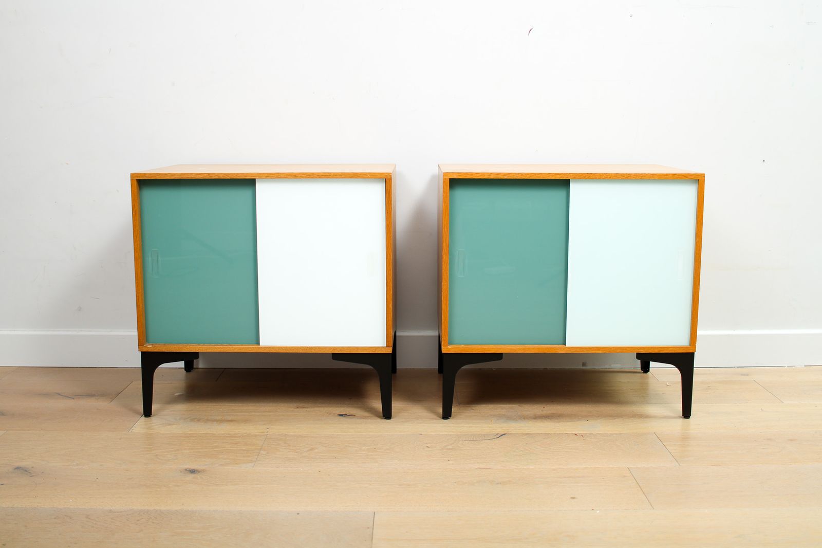 A Pair Of Vintage Mid Century Bedside Tables With Glass Sliding Doors photo furniture