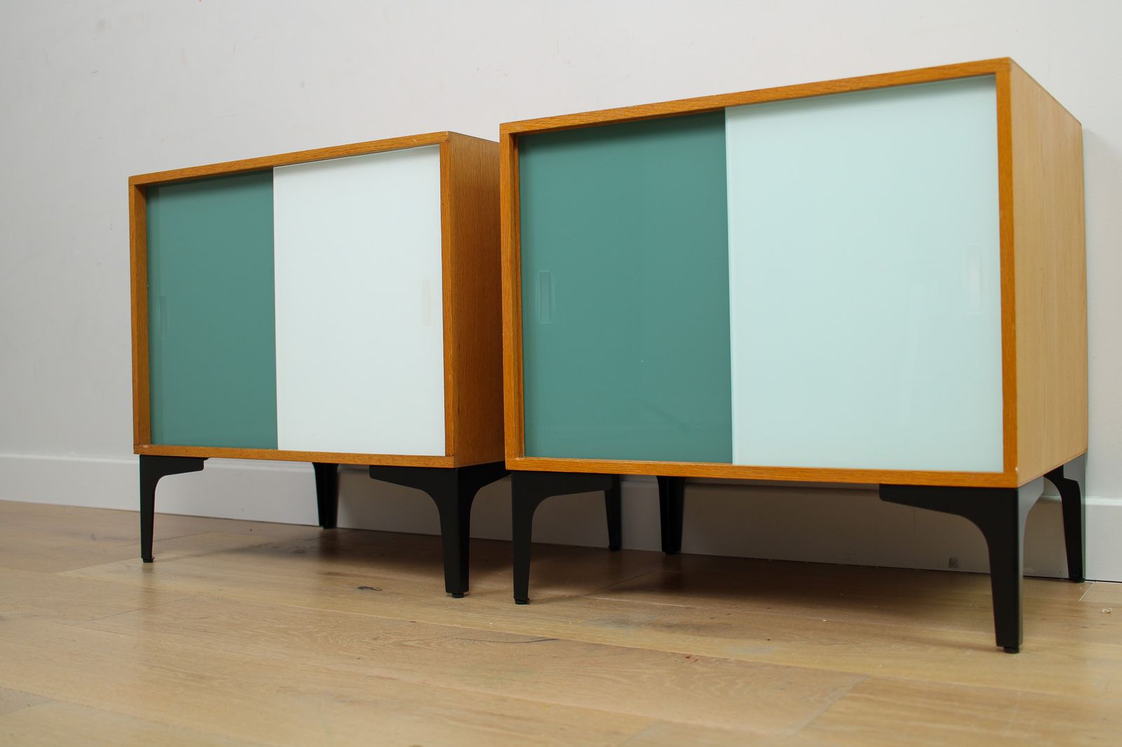 A Pair Of Vintage Mid Century Bedside Tables With Glass Sliding Doors photo 450.0