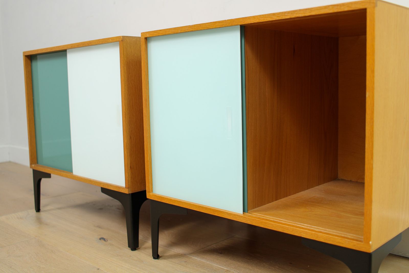 photo furniture A Pair Of Vintage Mid Century Bedside Tables With Glass Sliding Doors