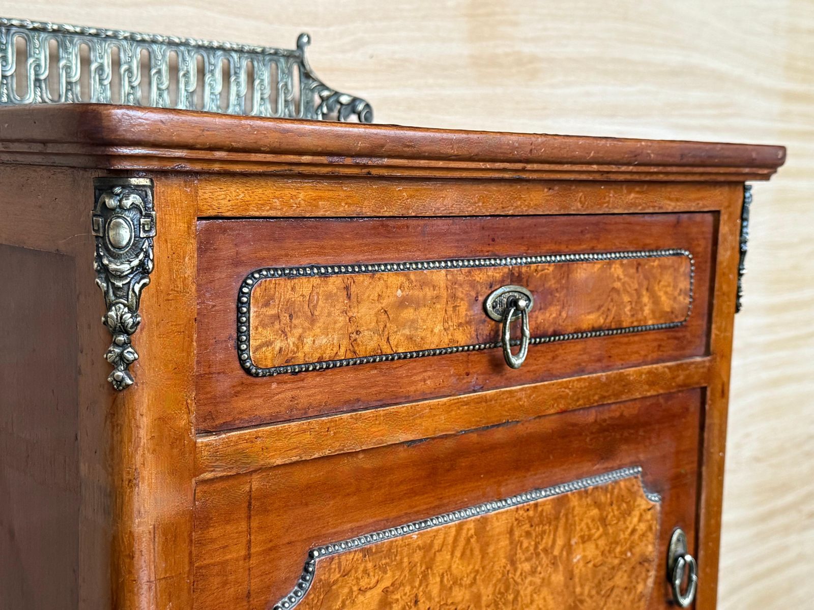 photo furniture Pair Of French Mahogany Nightstands With Drawer, Door And Bronze Crest