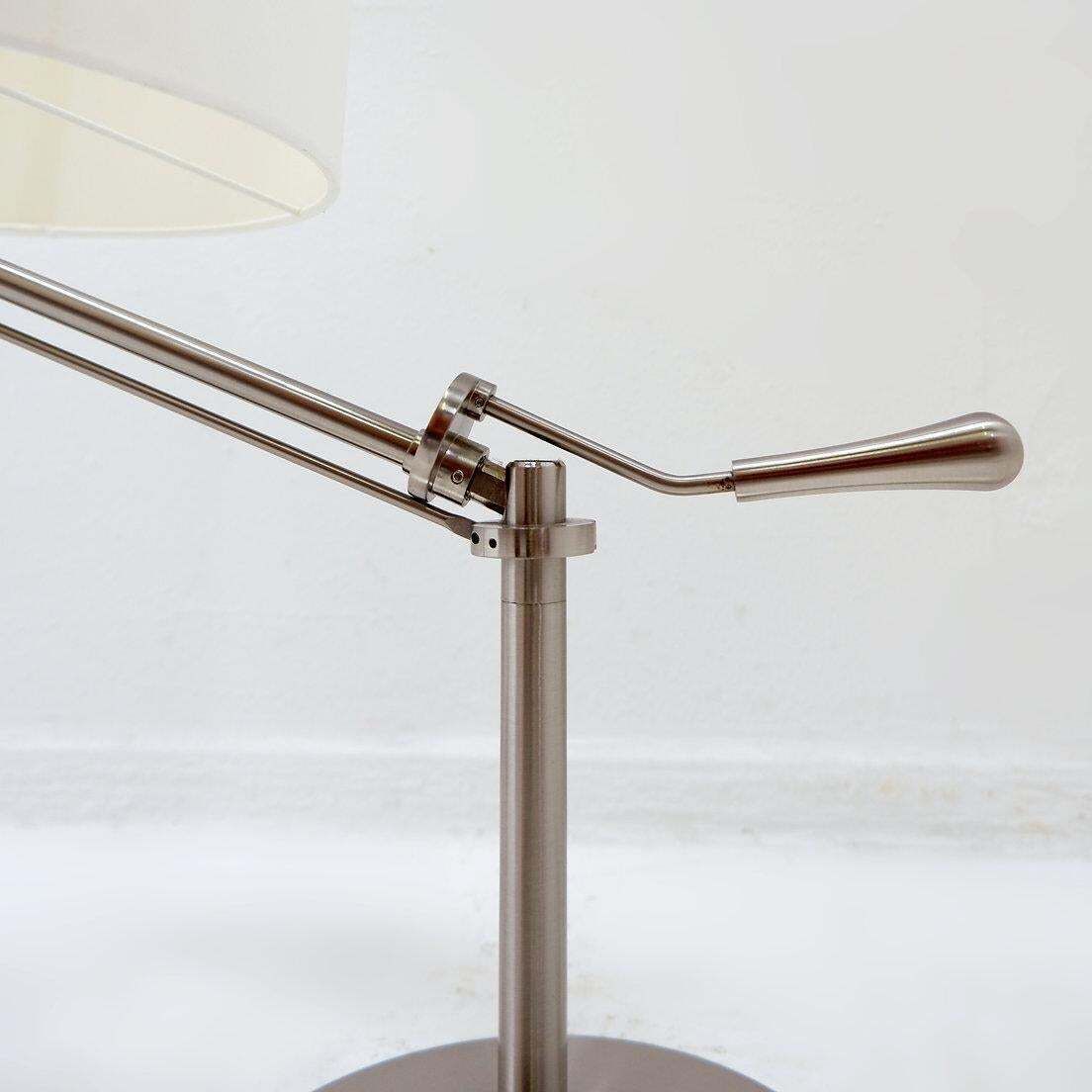 941.0 Pair Of Brushed Steel Table Lamps With Adjustable Rake   United Kingdom photo