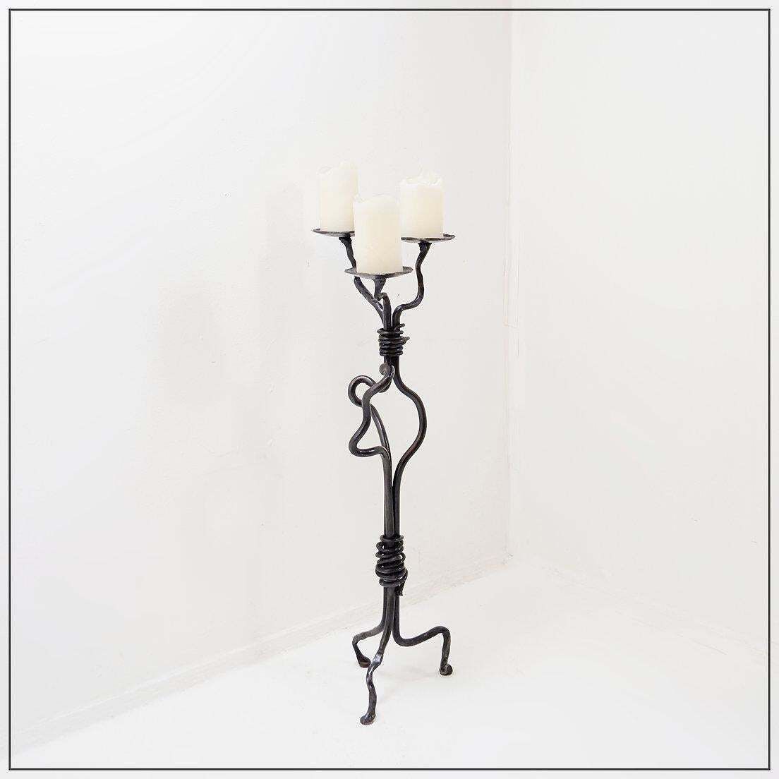 photo furniture Large Wrought Iron Candelabra With An Abstract Design And Three Candle Holders