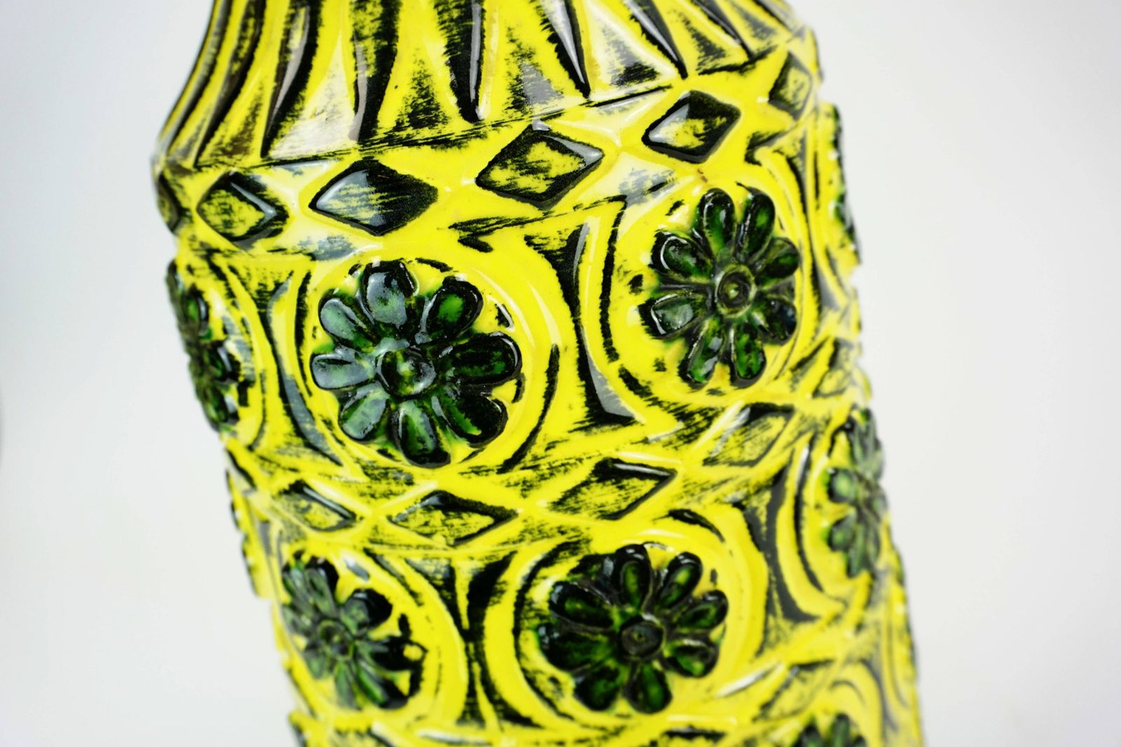1960s Bay Ceramic Vase With Raised Floral Decoration In Green, Yellow, And Black, Model 76 40 photo vintage