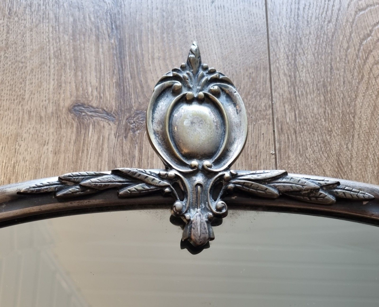 Early 20th Century Oval Silver Tone Metal Mirror Ornate Crest Bevelled Edge photo for sale