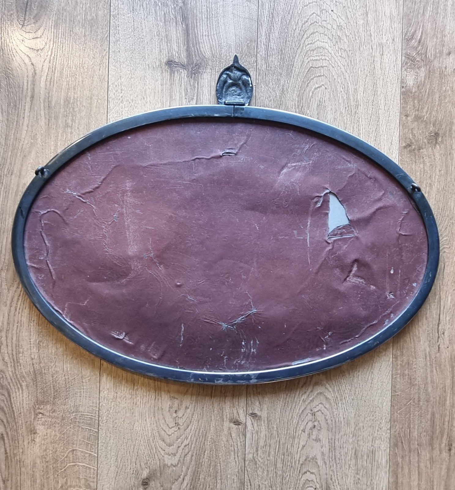 photo for sale Early 20th Century Oval Silver Tone Metal Mirror Ornate Crest Bevelled Edge