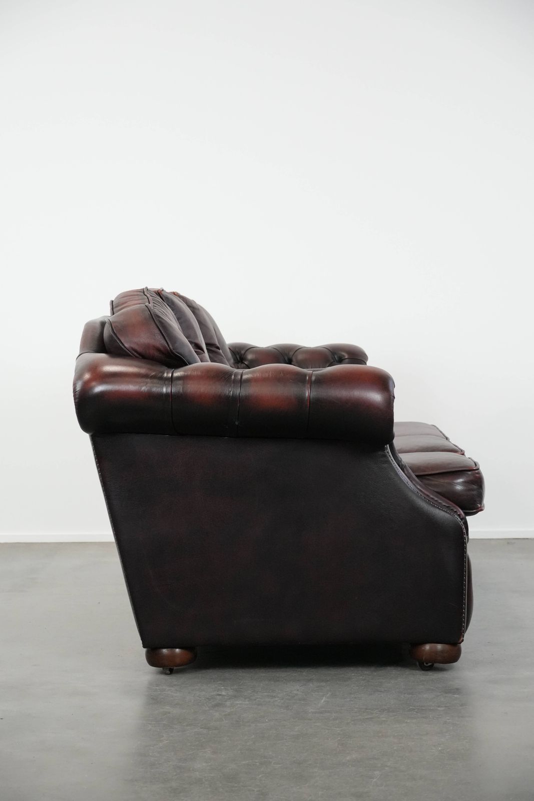 Beautiful Red 2.5 Seater Chesterfield Sofa On English Style Wheels Made Of Thick Cow Leather photo furniture