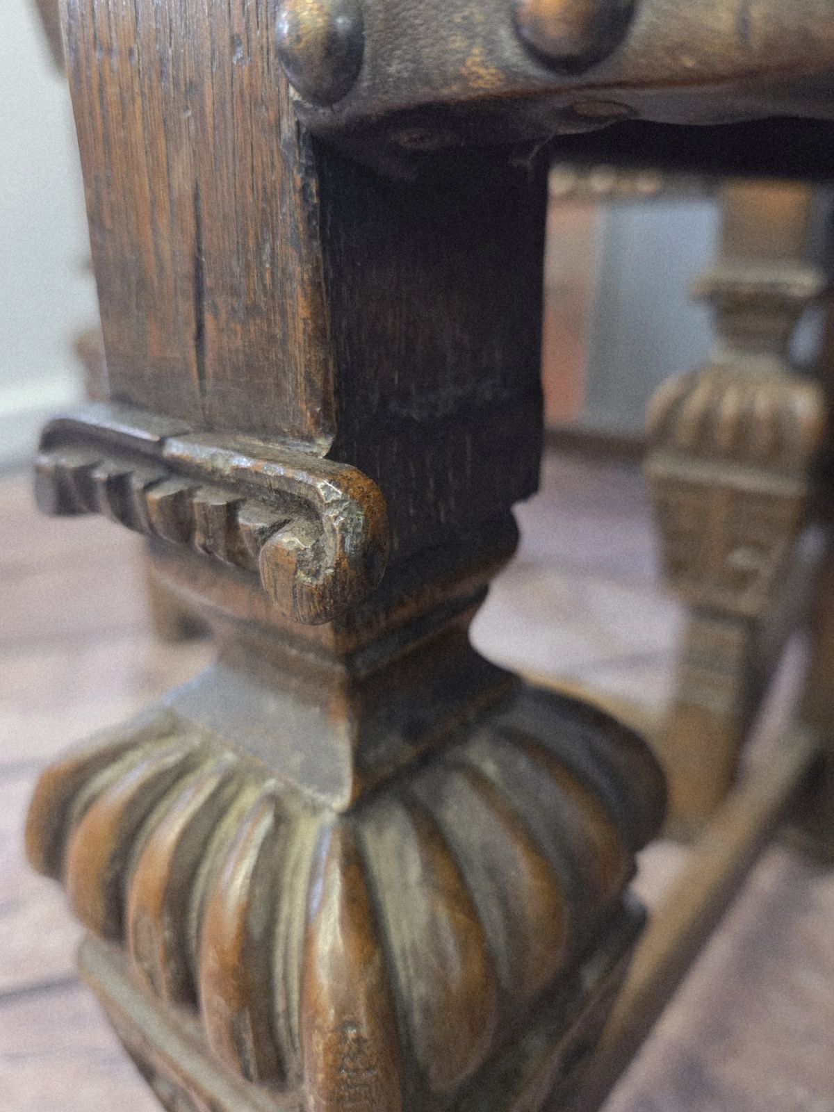 photo furniture Pair Of Late 19th Century Jacobean Revival Carved Oak Armchairs With Original Studded Leather