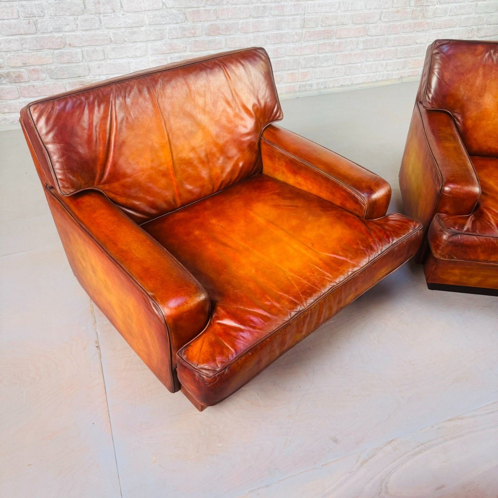 2085.0 Pair Of Arne Norell Swedish Tan Leather Lounge Chairs photo